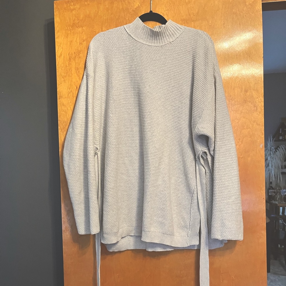 FP Beach oversized mock neck sweater with side slit and  ties